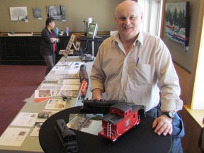 Tom Walter stands with a display of model rail cars set up next to a table filled with information and artifacts about a rail spur line he is writing a book about. His display was part of a Petrolia Heritage Committee Open House held at Victoria Hall on Saturday February 20, 2016 in Petrolia, Ont. Paul Morden/Sarnia Observer/Postmedia Network