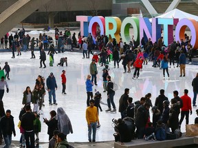 Despite the warm weather the skating rink at Nathan Phillips Square in Toronto, was busy with skaters on Feb. 20, 2016. (Dave Abel/Toronto Sun/Postmedia Network)