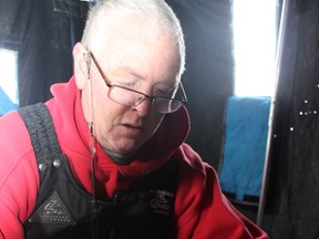 Mike Condon catches a healthy-sized perch on Lake Simcoe.(HANDOUT)