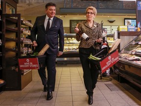 Ontario Premier Kathleen Wynne along with Finance Minister Charles Sousa give an update on wine being sold in grocery stores across Ont. at the Longo's on Laird Dr. in Toronto, Ont. on Thursday February 18, 2016. (Dave Thomas, Postmedia Network)