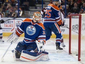 Cam Talbot and Darnell Nurse of the Edmonton Oilers, watch the puck cross the goal line to give the Colorado Avalanche at 2-1 lead in the second period at Rexall Place in Edmonton.