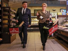 Ontario Premier Kathleen Wynne along with Finance Minister Charles Sousa give an update on wine being sold in grocery stores across Ont. at the Longo's on Laird Dr. in Toronto, Ont. on February 18.(Dave Thomas/Postmedia Network)