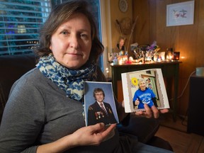 Deborah Magdee holds photographs of her deceased mother 87 year-old Elizabeth at her home in Vancouver, B.C., Monday, Feb. 15, 2016. It's only because Deborah Magdee happened to overhear a radio show two years ago that she left her mother's dead body at home for five days. The radio segment introduced the Vancouverite to home funerals, where family and friends assume the role of a mortician rather than relying on a morgue. Proponents say it's a cheaper, more intimate experience that can help loved ones with their grief. THE CANADIAN PRESS/Jonathan Hayward