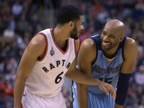 Toronto Raptors' Cory Joseph shares a joke with Memphis Grizzlies' Vince Carter during second-half action at the Air Canada Centre in Toronto on Feb. 21, 2016. (THE CANADIAN PRESS/Chris Young)