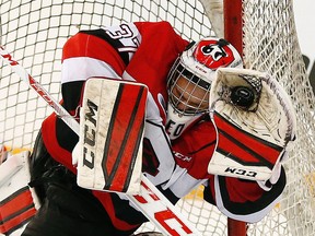 Ottawa 67s' goalie Leo Lazarev makes a diving glove save against the Windsor Spitfires during the second period of OHL action at TD Place Arena in Ottawa on Feb. 14, 2016. (Darren Brown/Postmedia)