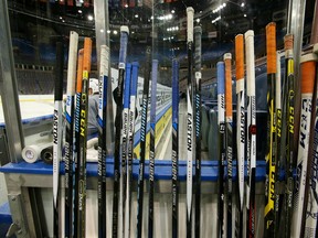 Hockey sticks are lined-up next to the bench during practise at Rexall Place in Edmonton on Tuesday Oct. 6, 2015. Tom Braid/Edmonton Sun/Postmedia Network.