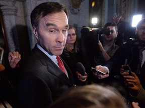 Finance Minister Bill Morneau speaks to reporters following a Liberal cabinet meeting on Parliament Hill in Ottawa on Feb. 2, 2016. THE CANADIAN PRESS/Sean Kilpatrick