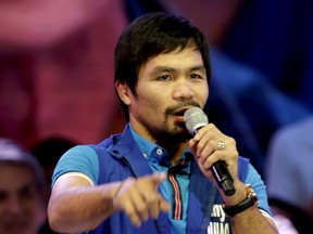 Filipino boxer Manny Pacquiao, who is running for Senator in the May 2016 vice-presidential election, speaks to supporters during the start of national elections campaigning in Mandaluyong, Philippines on Feb. 9, 2016. (Janis Alano/Reuters)