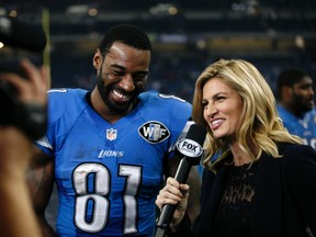 Lions wide receiver Calvin Johnson laughs with Fox Sports sideline reporter Erin Andrews after a game against the Eagles in Detroit on Nov. 26, 2015. (Raj Mehta/USA TODAY Sports)