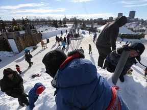 Kids and parents find their way to the top of the snow hill during Festival du Voyageur earlier this month. (Kevin King/Winnipeg Sun file photo)