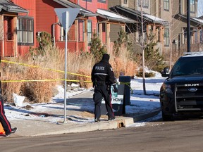 Police tape off crime scene that included a pool of blood, at the corner of Chappelle Road and Chappelle Drive on February 21, 2016 in Edmonton.  (Greg Southam)
