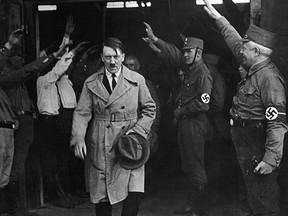 In this file photo Adolf Hitler, leader of the National Socialists, emerges from the party's Munich headquarters.  (AP Photo/file)