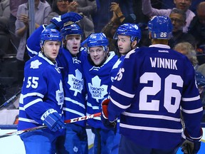 Toronto Maple Leaf players celebrate a goal against the Philadelphia Flyers during NHL action at the Air Canada Centre in Toronto on Feb. 20, 2016. (Dave Abel/Toronto Sun/Postmedia Network)