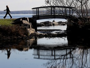A woman walks along the Bayshore Trail on Tuesday November 24, 2015 in Belleville, Ont. (Emily Mountney-Lessard/Postmedia Network/File)