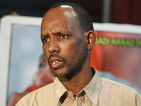 Mahamad Accord with the Canadian Somali Congress speaks to the media during a town hall meeting with the Somali community held at Belvedere Community Hall in Edmonton, Alta., on Saturday, April 5, 2014. Attendees at the meeting discussed the case of two Somali-Canadian children, taken from their parents in 2008. Accord is advocating for more Somali parents to become foster parents to foster Somali-Canadian children. Ian Kucerak