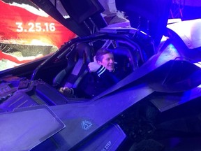 Mayor John Tory sits in the Batmobile at the Canadian International Auto Show in Toronto Sunday, Feb. 21, 2016. (Terry Davidson/Toronto Sun)