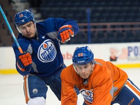 nail yakupov, left, and Brandon Davisdson battle during a drill during Oilers practice on Monday at Rexall Place. (Shaughn Butts)