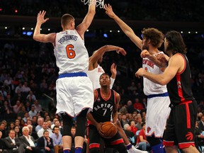 Toronto Raptors guard Kyle Lowry looks to drive up through New York Knicks defense during the first quarter at Madison Square Garden in New York on Feb. 22, 2016. (Anthony Gruppuso/USA TODAY Sports)