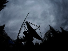 A truck-mounted radar instrument called the Doppler On Wheels is silhouetted against cloudy skies in Washington, in this Nov. 6, 2015 file photo. (TED S. WARREN/AP)
