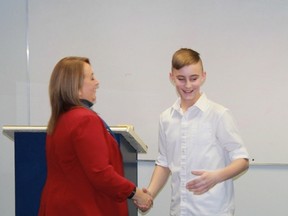 Sarnia Toastmasters' Elizabeth Bainbridge shakes hands with cadet Brock Robbins after Robbins gives a talk about the power of positive messaging. 
CARL HNATYSHYN/SARNIA THIS WEEK