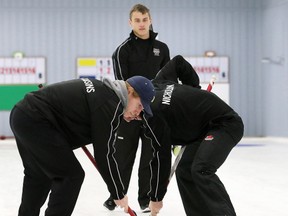 Wallaceburg Tartans second Matt Cousins, left, and lead Zac Nicholson sweep as vice Brad Maxim watches during a 7-3 loss to the Northern Vikings in the LKSSAA boys curling final Monday at the Golden Acres Curling Club in Blenheim. Skip Alex Gough and co-second Andrew Babbitt are the other Tartans, who'll join the Vikings at the SWOSSAA semifinals Wednesday in Windsor.;