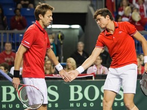 Daniel Nestor (left) and Milos Raonic (right) were named to Canada's Davis Cup team for a first-round tie against France next month. (Ben Nelms/Reuters/Files)