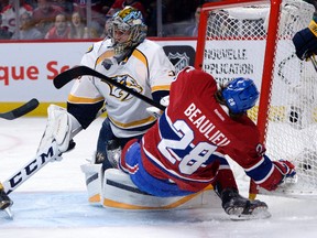 Canadiens defenceman Nathan Beaulieu crashes into Predators goalie Pekka Rinne during third period NHL action at the Bell Centre in Montreal on Monday, Feb. 22, 2016. (Eric Bolte/USA TODAY Sports)