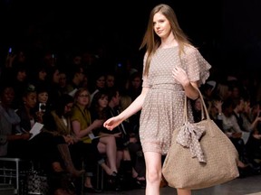 A model shows creations by Jessica Jensen and Alexander Berardi during Toronto Fashion Week in Toronto on October 19, 2010. Canadian designer Jessica Jensen is closing up shop on her namesake collection. In an email addressed to customers on Tuesday, Jensen announced she would no longer be producing handbags and accessories for the Jessica Jensen Collection, and would stop selling online March 5. (THE CANADIAN PRESS/Darren Calabrese)