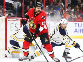 Zack Smith of the Ottawa Senators battles against Sam Reinhart of the Buffalo Sabres during third period of NHL action at Canadian Tire Centre in Ottawa on Feb. 16, 2016. (Jean Levac/Postmedia)