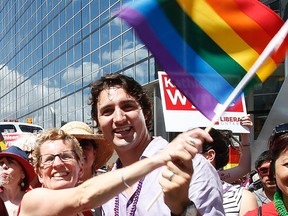 Ontario Premier Kathleen Wynn and federal Liberal leader Justin Trudeau take part in the Toronto Pride parade June 30, 2013. (Craig Robertson/Toronto Sun)
