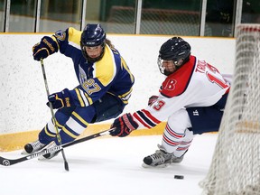 Laurentian Voyageurs' Emma Leger fights off a Brock Badgers player during OUA women's hockey action at Gerry McCrory Countryside Sports Complex on Jan. 31. The LU women host the Guelph Gryphons in their playoff opener Wednesday night at Countryside at 7:50 p.m.