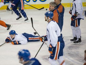 Lauri Korpikoski  lies on the ice during a power play drill at the the Edmonton Oilers practice at Rexall Place.  Shaughn Butts