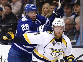 Brad Boyes of the Maple Leafs battles Ryan Ellis of the Nashville Predators on Feb. 23, 2016 at the Air Canada Centre in Toronto. (CRAIG ROBERTSON/Toronto Sun/Postmedia Network)