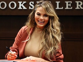 Chrissy Teigen at the book signing for "Cravings: Recipes For All The Food You Want To Eat" on February 24, 2016. (FayesVision/WENN.com)