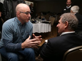 Jason Miller/The Intelligencer
Wade Watts, owner of Wheelchair Friendly Solutions, speaks to Louie DiPalma during a chamber of commerce event dealing with accessibility standards.