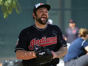 Cleveland Indians' Joba Chamberlain laughs along with teammates after his spring training baseball workout Tuesday, Feb. 23, 2016, in Goodyear, Ariz. (AP Photo/Ross D. Franklin)