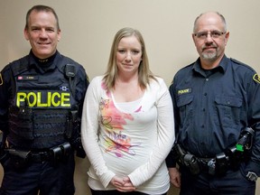 Meghan Balogh/Postmedia Network
Napanee OPP constables Steve Earle and Doug Weese stand with Candace Hawkins.