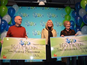 $60M Lotto Max winners John Henry of Mississauga, left, and Joan Patterson of Desboro, right, flank Wendy Montgomery, OLG's vice-president of lottery, marketing and sales, at an event held in Toronto on Wednesday, February 24, 2016. (Rob Gowan/Postmedia Network)