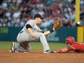 New York Yankees second baseman Stephen Drew prepares to tag Los Angeles Angels baserunner Mike Trout on a stolen base attempt at Angel Stadium of Anaheim. (Kirby Lee/USA TODAY Sports)