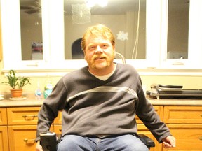 Jamie Stewart is pictured here in the kitchen of his Corunna home. Family and friends of Stewart are hoping to raise $80,000 to build him a new fully accessible home. Stewart, who is quadriplegic, currently struggles with navigating narrow door frames and hallways in his 1950s-era home. (Barbara Simpson, The Observer)