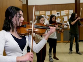 Bibi Henson, left, Imogen Moore and Jane Small man of the Canta Arya School for Strings rehearse on Wednesday January 20  2016 at St. James Church in Kingston. Ten members of the group are preparing for a five city concert tour of China in March. Ian MacAlpine /The Whig-Standard/Postmedia Network