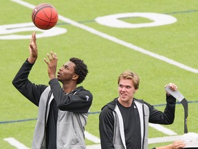 Canadian athletes Andrew Wiggins, left, and Connor McDavid shoot a commercial in Toronto on Tuesday, August 4, 2015. (THE CANADIAN PRESS/J.P. Moczulski)