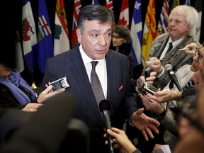Ontario Finance Minister Charles Sousa, with Federal and Provincial Finance Ministers, takes part in a news conference in Ottawa December 21, 2015.    REUTERS/Blair Gable
