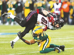 RedBlacks’ Greg Ellingson gets upended by Eskimos’ Cauchy Muamba during last season’s Grey Cup in Winnipeg. Ottawa Sports and Entertainment Group’s Jeff Hunt (above right) is hoping to bring the championship game to the nation’s capital in 2017. (Brian Donogh/Postmedia Network)