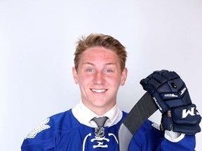 Travis Dermott poses after being selected 34th by the Toronto Maple Leafs during the 2015 NHL entry draft at BB&T Center on June 27, 2015 in Sunrise, Fla. (MIKE EHRMANN/Getty Images/AFP)