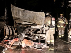Gino Donato/Sudbury Star
Greater Sudbury Fire Services firefighters were called to the scene of a truck fire in a carport on Hemlock street in Sudbury on Wednesday. There was no word on a cause on the blaze, which was quickly put out.