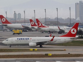 File photograph shows a Turkish Airlines Boeing 737 taxiing in front of other aircraft at Ataturk International Airport in Istanbul, Turkey November 30, 2012.  REUTERS/Osman Orsal/Files