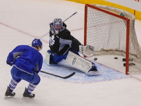 Toronto Maple Leafs Mark Arcobello puts the puck past goalie Jonathan Bernier during the morning skate on Feb.  25, 2016. (Dave Thomas/Toronto Sun)