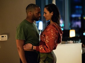 This image released by Open Road Films shows Chiwetel Ejiofor, left, Gal Gadot in a scene from "Triple 9." (Bob Mahoney/Open Road Films)