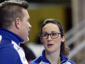 Nova Scotia skip Jill Brothers (right) listens in on coach Daryell Nowlan (left) during Draw 11 of the Scotties Tournament of Hearts at Revolution Place in Grande Prairie, Alta., on Wednesday, Feb. 24, 2016. Brothers is one of several players at the championship with young children. (Logan Clow/Postmedia Network)